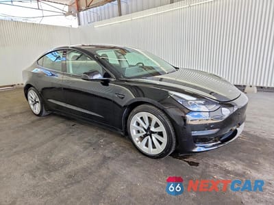 Czwarte zdjęcie samochodu z boku: 2023 TESLA MODEL 3 VIN:5YJ3E1EA7PF437897 - miniatura