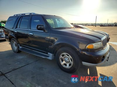Czwarte zdjęcie samochodu z boku: 2002 LINCOLN NAVIGATOR VIN:5LMEU27R72LJ06501 - miniatura