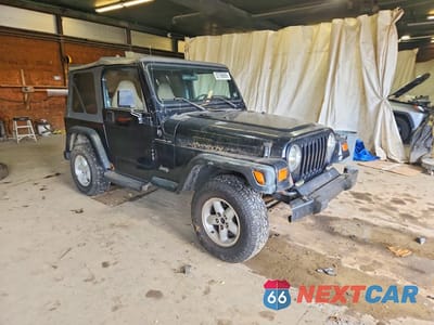 Czwarte zdjęcie samochodu z boku: 1999 JEEP WRANGLER / TJ SE VIN:1J4FY29P3XP466242 - miniatura