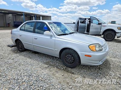 Czwarte zdjęcie samochodu z boku: 2004 HYUNDAI ACCENT GL VIN:KMHCG45C64U553507 - miniatura