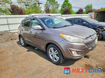 Czwarte zdjęcie samochodu z boku: 2012 HYUNDAI TUCSON GLS VIN:KM8JUCAC1CU415808 - miniatura