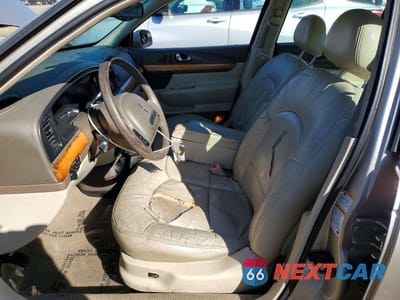 Zdjęcie 7 z 12 samochodu: 2002 LINCOLN CONTINENTAL VIN:1LNHM97V62Y699843 - miniatura