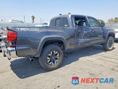 Trzecie zdjęcie samochodu z tyłu: 2019 TOYOTA TACOMA TRD OFF-ROAD VIN:3TMDZ5BN2KM059189 - miniatura