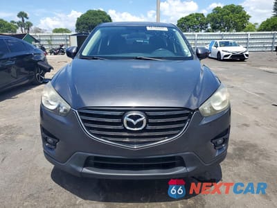 Piąte zdjęcie samochodu w środku: 2016 MAZDA CX-5 TOURING VIN:JM3KE2CYXG0900641 - miniatura