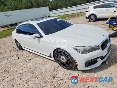 Czwarte zdjęcie samochodu z boku: 2016 BMW 740 I VIN:WBA7E2C59GG548029 - miniatura