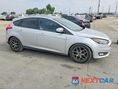 Czwarte zdjęcie samochodu z boku: 2018 FORD FOCUS SEL VIN:1FADP3M27JL211390 - miniatura