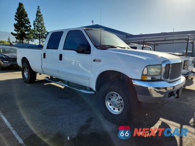 Czwarte zdjęcie samochodu z boku: 2002 FORD F250 SUPER DUTY VIN:1FTNW20S82EA09312 - miniatura