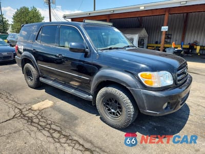 Czwarte zdjęcie samochodu z boku: 2001 TOYOTA SEQUOIA LIMITED VIN:5TDBT48A01S023846 - miniatura