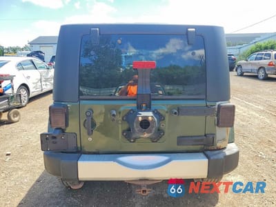 Zdjęcie 6 z 13 samochodu: 2009 JEEP WRANGLER UNLIMITED SAHARA VIN:1J4GA59159L733168 - miniatura