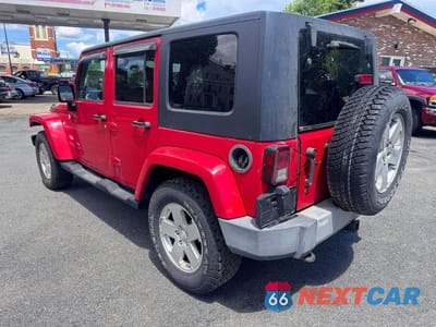 Trzecie zdjęcie samochodu z tyłu: 2010 JEEP WRANGLER UNLIMITED SAHARA VIN:1J4BA5H16AL215165 - miniatura
