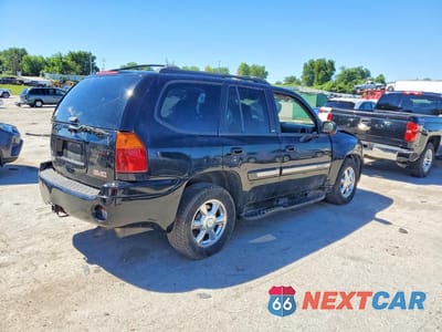 Trzecie zdjęcie samochodu z tyłu: 2004 GMC ENVOY VIN:1GKDT13S242100286 - miniatura