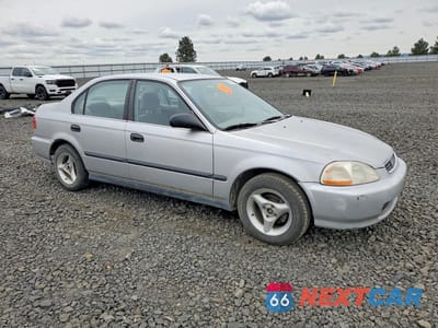 Czwarte zdjęcie samochodu z boku: 1997 HONDA CIVIC LX VIN:JHMEJ6575VS007418 - miniatura