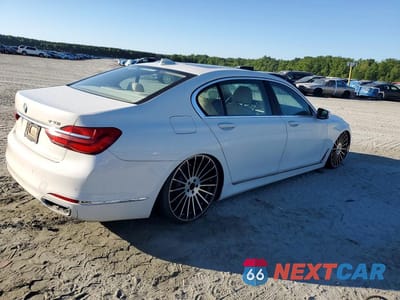 Trzecie zdjęcie samochodu z tyłu: 2016 BMW 740 I VIN:WBA7E2C57GGD99896 - miniatura