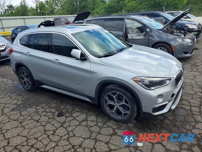 Czwarte zdjęcie samochodu z boku: 2016 BMW X1 XDRIVE28I VIN:WBXHT3C34G5E52411 - miniatura
