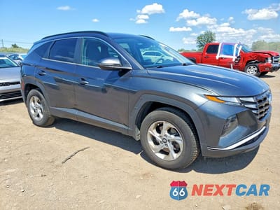 Czwarte zdjęcie samochodu z boku: 2022 HYUNDAI TUCSON SEL VIN:5NMJBCAEXNH039972 - miniatura