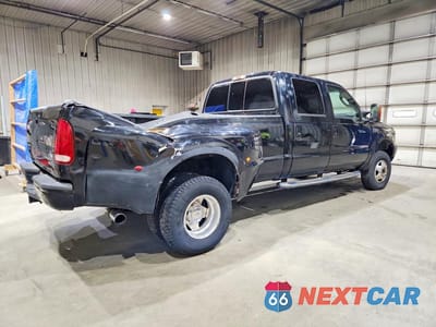 Trzecie zdjęcie samochodu z tyłu: 2003 FORD F350 SUPER DUTY VIN:1FTWW33P23EC50057 - miniatura