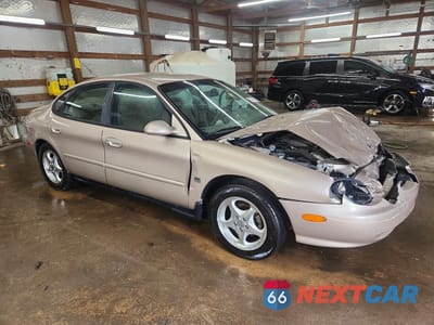 Czwarte zdjęcie samochodu z boku: 1999 FORD TAURUS SE VIN:1FAFP53S3XG214293 - miniatura