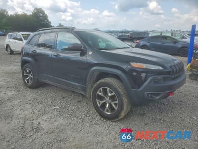 Czwarte zdjęcie samochodu z boku: 2014 JEEP CHEROKEE TRAILHAWK VIN:1C4PJMBSXEW170162 - miniatura