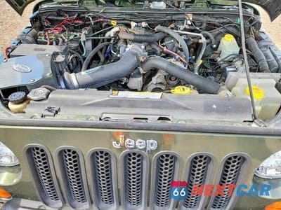 Zdjęcie 12 z 13 samochodu: 2007 JEEP WRANGLER SAHARA VIN:1J4GA59107L198750 - miniatura