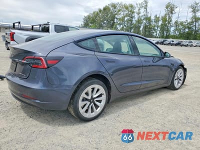 Trzecie zdjęcie samochodu z tyłu: 2023 TESLA MODEL 3 VIN:5YJ3E1EB6PF636562 - miniatura