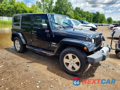 Czwarte zdjęcie samochodu z boku: 2010 JEEP WRANGLER UNLIMITED SAHARA VIN:1J4BA5H18AL205639 - miniatura