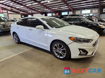 Czwarte zdjęcie samochodu z boku: 2020 FORD FUSION TITANIUM VIN:3FA6P0RU4LR100186 - miniatura