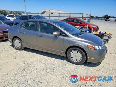 Czwarte zdjęcie samochodu z boku: 2006 HONDA CIVIC HYBRID VIN:JHMFA362X6S009625 - miniatura