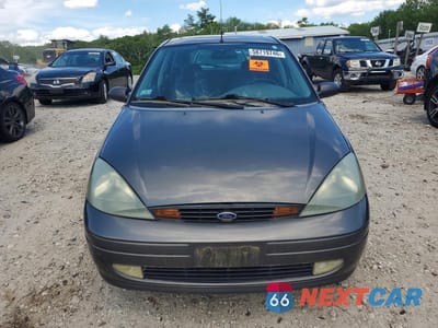 Piąte zdjęcie samochodu w środku: 2004 FORD FOCUS ZX5 VIN:3FAFP37Z84R110902 - miniatura