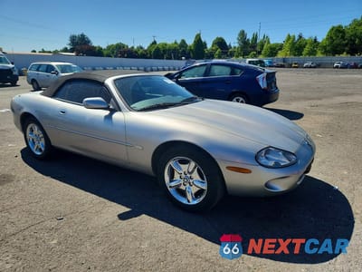 Czwarte zdjęcie samochodu z boku: 1999 JAGUAR XK8 VIN:SAJGX2049XC041200 - miniatura