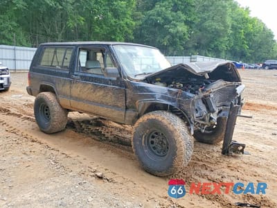 Czwarte zdjęcie samochodu z boku: 1994 JEEP CHEROKEE SPORT VIN:1J4FT67S6RL130866 - miniatura