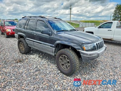 Czwarte zdjęcie samochodu z boku: 1999 JEEP GRAND CHEROKEE SPORT VIN:1J4GW58S6XC587386 - miniatura