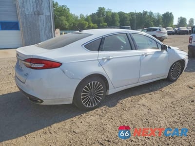 Trzecie zdjęcie samochodu z tyłu: 2017 FORD FUSION SE VIN:3FA6P0H91HR395994 - miniatura