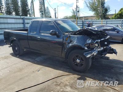 Czwarte zdjęcie samochodu z boku: 2003 FORD F150 VIN:1FTRX17223NA31774 - miniatura
