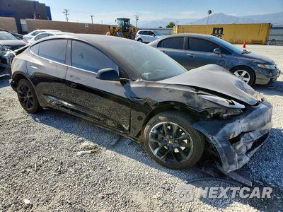 Czwarte zdjęcie samochodu z boku: 2022 TESLA MODEL 3 VIN:5YJ3E1EB5NF239096 - miniatura