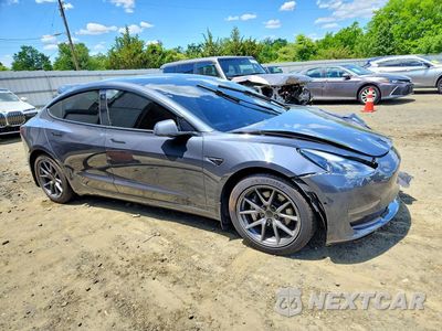 Czwarte zdjęcie samochodu z boku: 2021 TESLA MODEL 3 VIN:5YJ3E1EA6MF016779 - miniatura