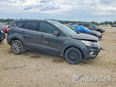 Czwarte zdjęcie samochodu z boku: 2017 FORD ESCAPE TITANIUM VIN:1FMCU0JD9HUB36775 - miniatura