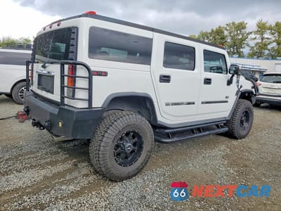 Trzecie zdjęcie samochodu z tyłu: 2004 HUMMER H2 VIN:5GRGN23U74H100340 - miniatura