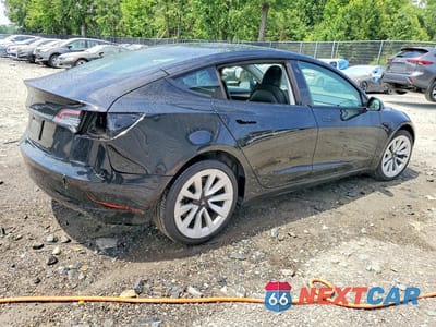 Trzecie zdjęcie samochodu z tyłu: 2023 TESLA MODEL 3 VIN:5YJ3E1EA5PF451247 - miniatura