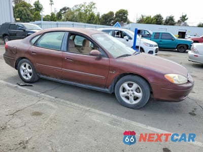 Czwarte zdjęcie samochodu z boku: 2000 FORD TAURUS SES VIN:1FAFP5525YG146528 - miniatura