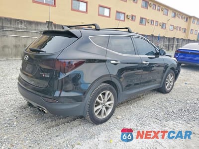 Trzecie zdjęcie samochodu z tyłu: 2015 HYUNDAI SANTA FE SPORT 2.0T VIN:5XYZUDLA0FG266371 - miniatura