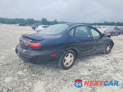 Trzecie zdjęcie samochodu z tyłu: 1999 FORD TAURUS SE VIN:1FAFP53S2XA169429 - miniatura
