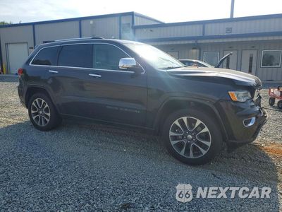 Czwarte zdjęcie samochodu z boku: 2017 JEEP GRAND CHEROKEE OVERLAND VIN:1C4RJFCT5HC727156 - miniatura