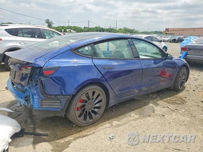 Trzecie zdjęcie samochodu z tyłu: 2023 TESLA MODEL 3 VIN:5YJ3E1EC9PF472300 - miniatura