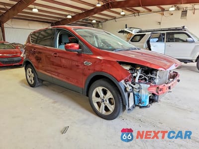 Czwarte zdjęcie samochodu z boku: 2016 FORD ESCAPE SE VIN:1FMCU9GX1GUC75786 - miniatura