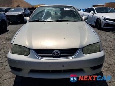 Piąte zdjęcie samochodu w środku: 2002 TOYOTA COROLLA LE VIN:1NXBR12E52Z584769 - miniatura