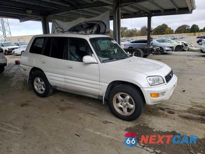 Czwarte zdjęcie samochodu z boku: 1999 TOYOTA RAV4 BASE VIN:JT3HP10V7X7135353 - miniatura
