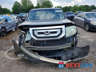 Piąte zdjęcie samochodu w środku: 2011 HONDA PILOT LX VIN:5FNYF4H20BB097932 - miniatura