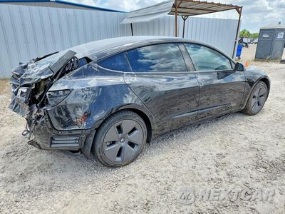 Trzecie zdjęcie samochodu z tyłu: 2023 TESLA MODEL 3 VIN:5YJ3E1EA4PF460120 - miniatura