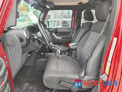 Zdjęcie 7 z 13 samochodu: 2012 JEEP WRANGLER UNLIMITED SAHARA VIN:1C4HJWEG2CL111886 - miniatura