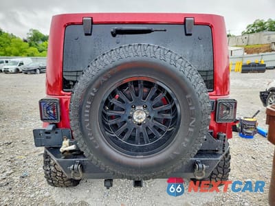 Zdjęcie 6 z 13 samochodu: 2012 JEEP WRANGLER UNLIMITED SAHARA VIN:1C4HJWEG2CL111886 - miniatura